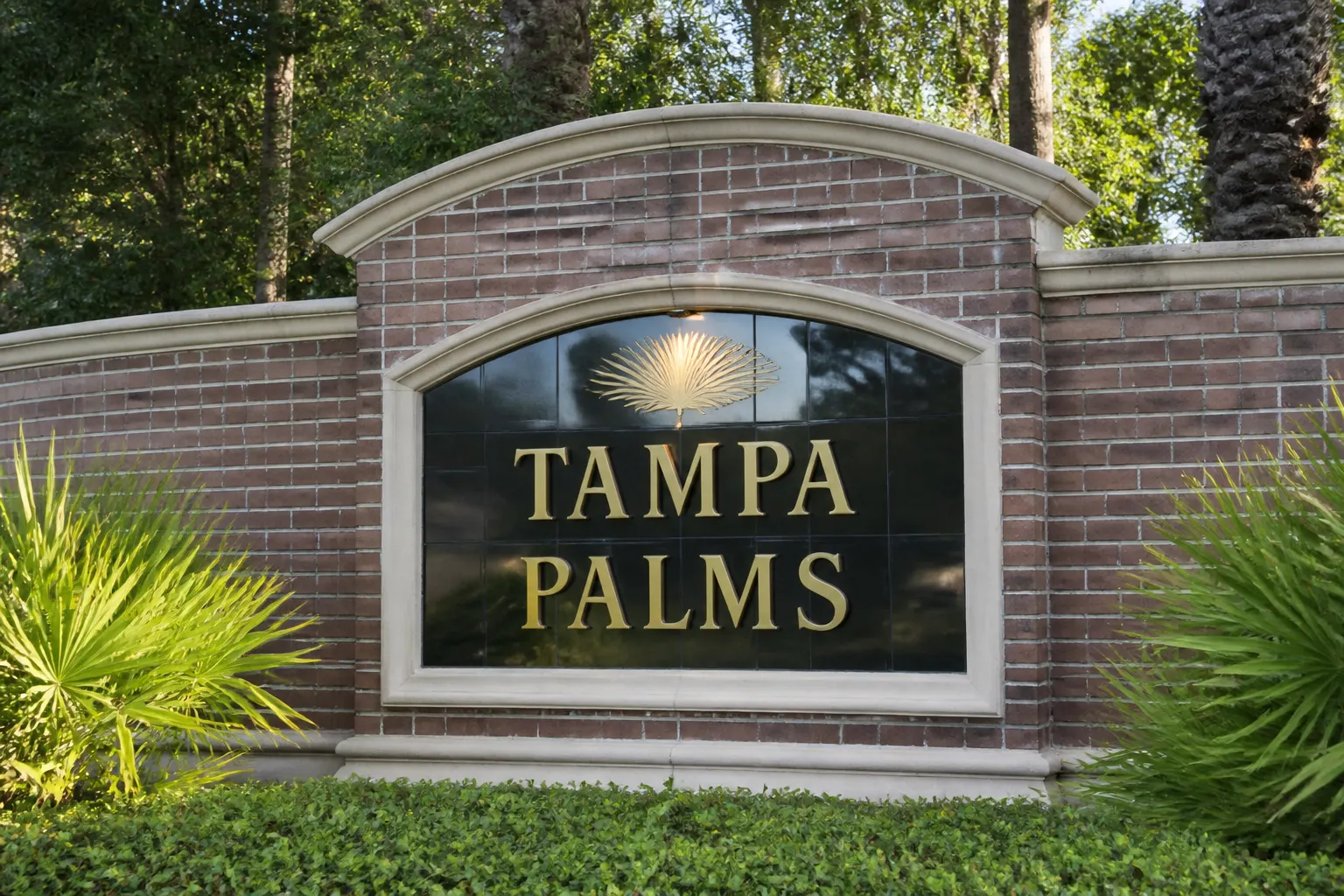 Tampa Palms brick entrance wall and sabal palms
