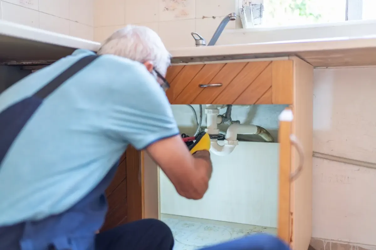 Plumber performing a backflow inspection