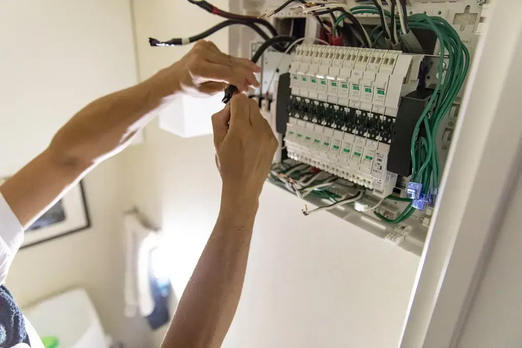 Whole-house surge protector mounted at the panel