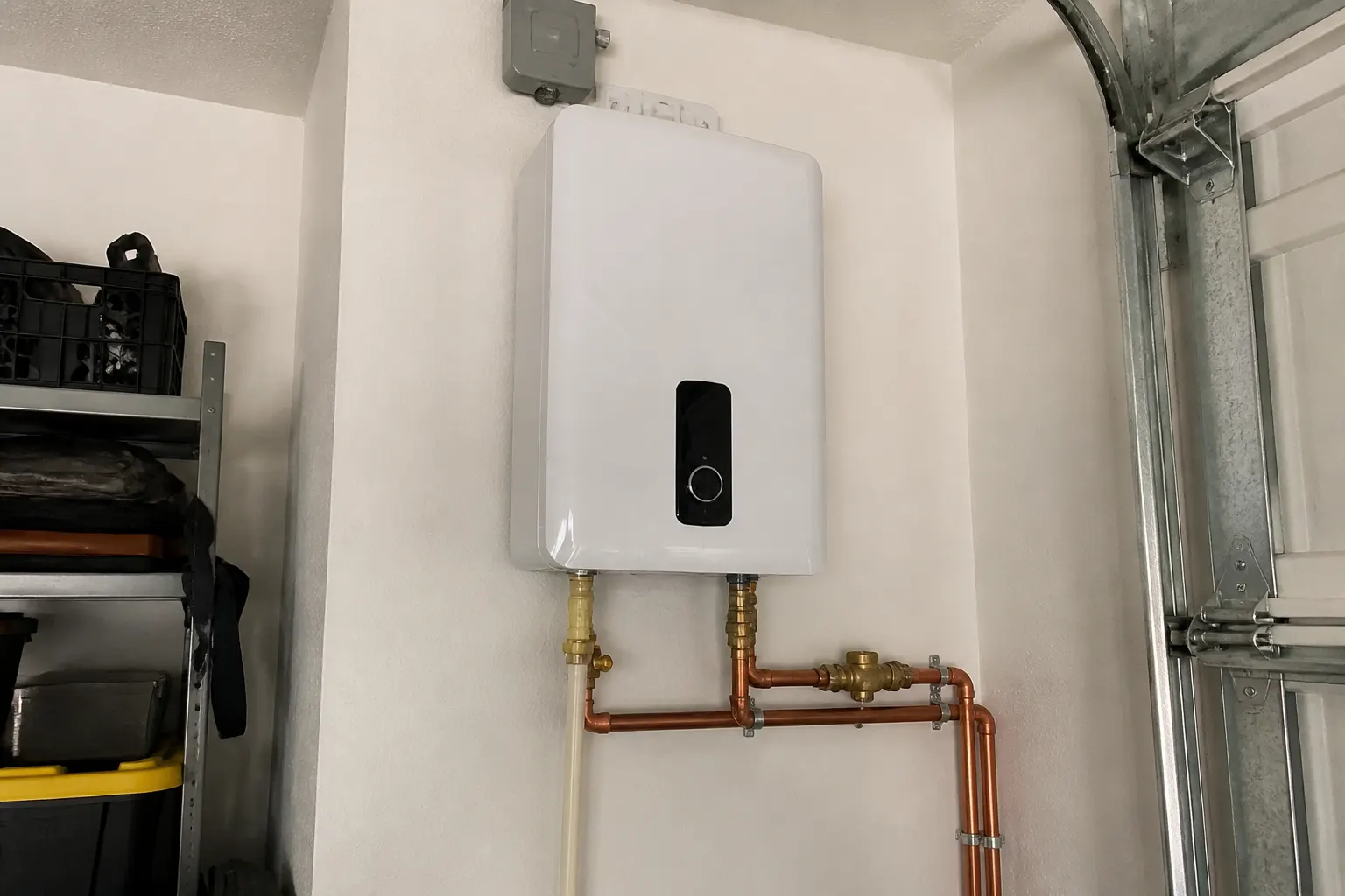 Generic tankless water heater on a Tampa garage wall with no brand marks